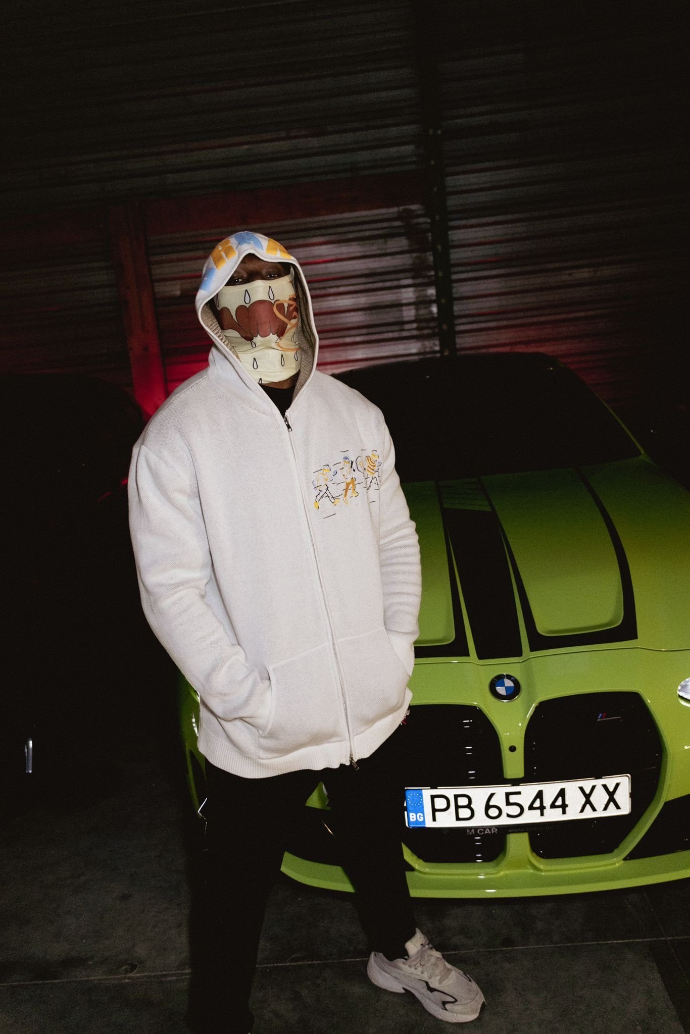 Model wearing an embroidered BRAKO hoodie