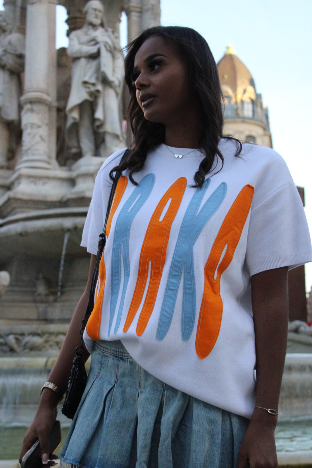 Model in the Heist Tee and Loot Bag above the rooftops of Lyon